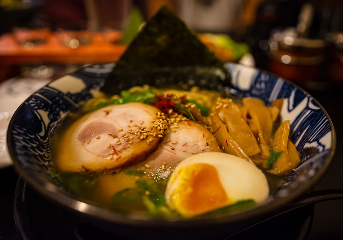 A steaming bowl of Japanese ramen with toppings